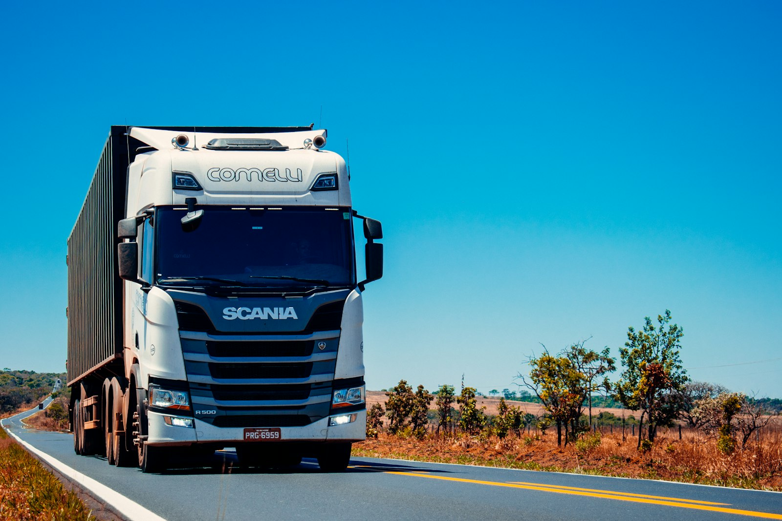 Truck on highway used for VighnaFree Logistics ground freight service